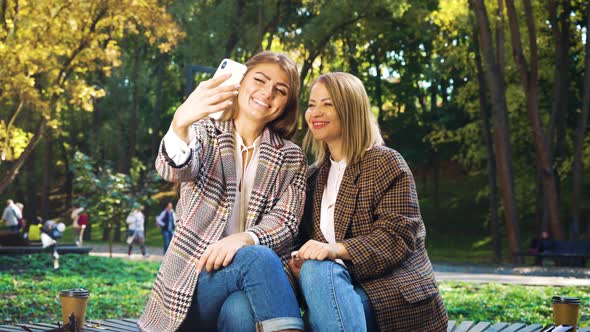 Soul mates having fun and taking selfie outside alt
