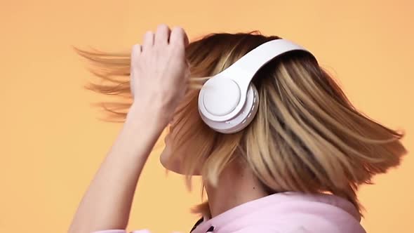 Blonde Woman Dance with Headphones