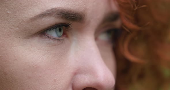 Close Up of Blue Eyed Young Ginger Attractive Girl Who Is Looking at Camera and Smiling alt