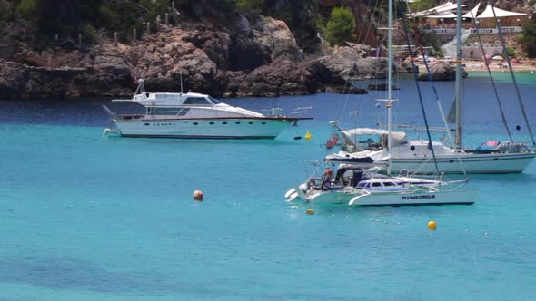 Yachts laying in a beautiful bay alt