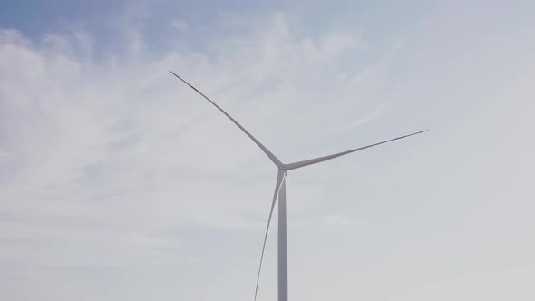 Wind Turbine on Cloudy Day in Countryside alt