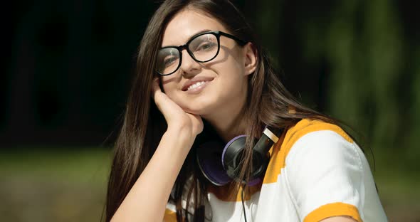 Portrait of Smiling Woman in Park