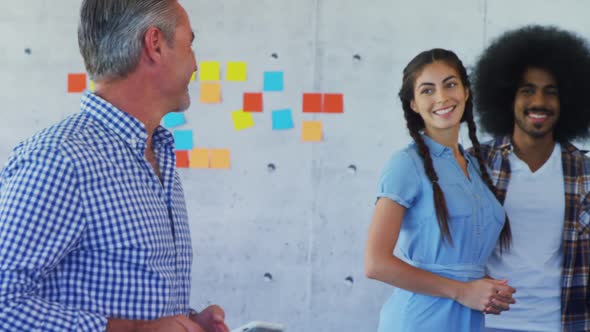 Smiling executing interacting while discussing on laptop 4k alt