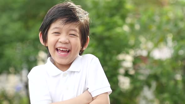 Close Up Of Happy Asian Child Outdoor Slow Motion alt