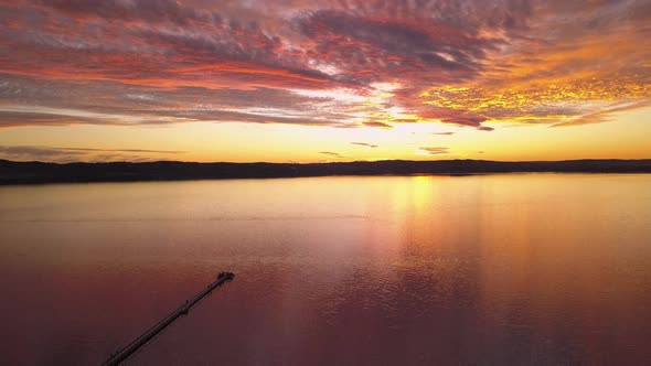 Beautiful sunrise or sunset at Sydney Skyline at Long Jetty Wharf. Central Coast, Australia. alt