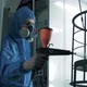 The paint engineer applies an even coat of paint to the metal frame of the future chair. - VideoHive Item for Sale