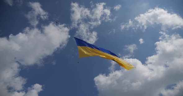 Ukraine Flag On A Background Of Blue Sky, Raised By A Drone In The Air, Develops In The Wind alt