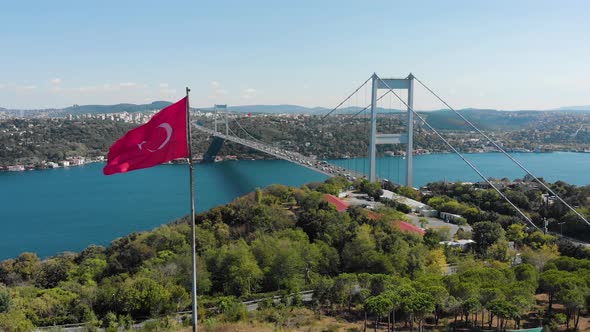 Aerial view of Fatih Sultan Mehmet Bridge and Turkish Flag alt