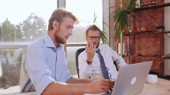 Succesful Caucasian Bearded Male Wearing Glasses Tie and White Shirt Discontentedly Discussing alt