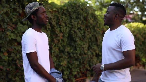 Two African Friends Communicate with Each Other alt