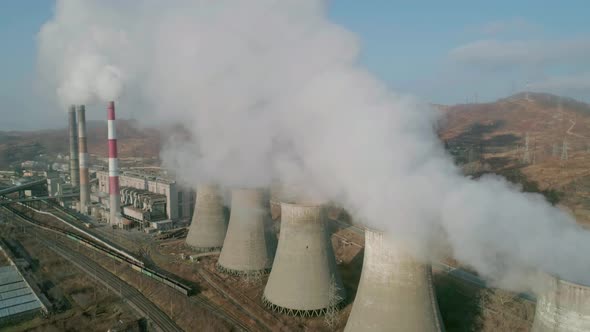 Aerial View of an Industrial Zone Pipes Pouring Thick White Smoke alt