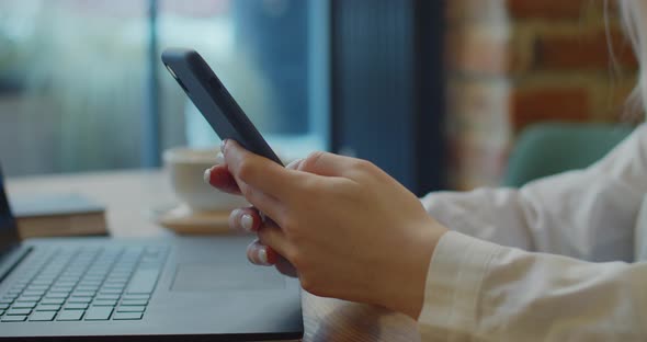 Closeup Hands of Young Woman Using Mobile Phone Social Media Checking Email Box Messages Sitting in alt