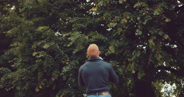 Dad Playing with His Son Throws Him Up and Catch Him alt