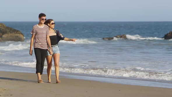 Young couple together at beach alt