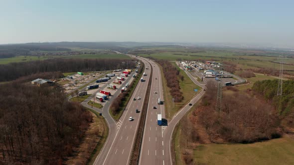 Forwards Tracking Car Turning Onto Petrol Station From Multilane Highway Autobahn in Germany alt