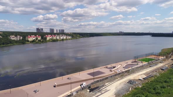Aerial view of construction of an embankment in the city on the river bank 01 alt