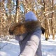 Girl Holding Male Hand and Running Through Snowy Forest at Cold Sunny Day - VideoHive Item for Sale