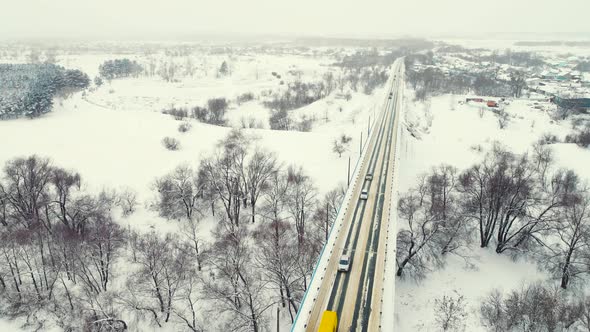 Dramatic Winter Landscape Aerial View Narrow Road in the Field alt