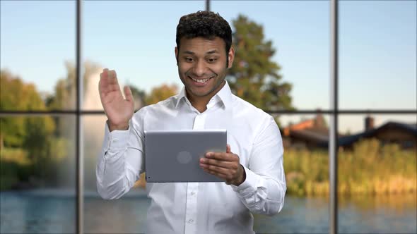 Cheerful Businessman Talking Via Internet alt