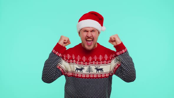 Cheerful Man in Red Sweater Christmas Santa Shouting Celebrating Success Winning Goal Achievemen alt