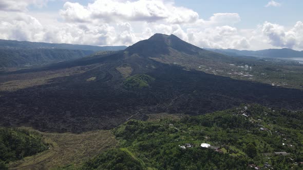 Aerial view of lava field from Mount Batur in Bali alt