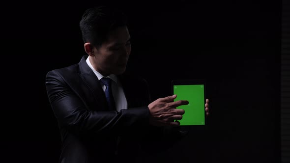 Businessman with tablet alt