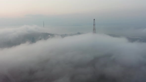 Drone View of the City Bay and Big Bridge Covered with Fog at Sunset alt