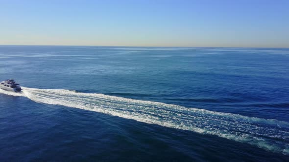Aerial drone uav view of a motor boat and the ocean. alt