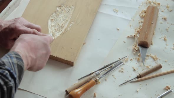 Closeup shoot of a woodcarver at work