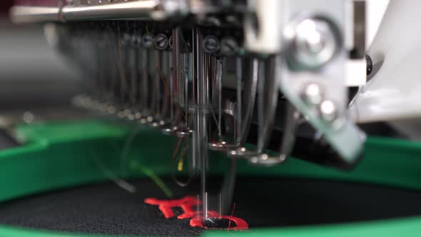 Robot Sewing Machine Automatic Sewing Machine an Automated Machine Embroiders Pattern with Red alt