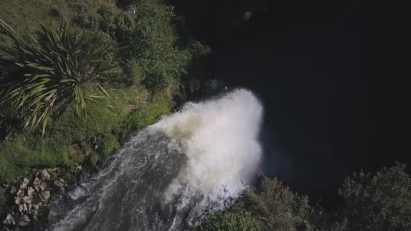 Top-down aerial view of waterfall stream alt
