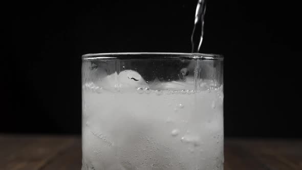 Sprite or water poured into glass