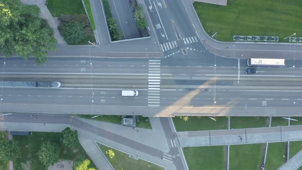 Top down static aerial view above an intersection in Helsinki, Finland with bus turning. alt