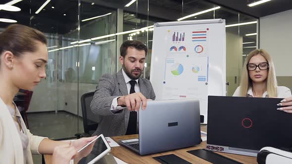  Business People which Sitting at the Boardroom Table and Working alt