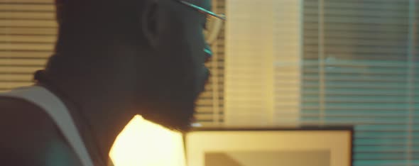 African American Man Taking Pills before Bed alt