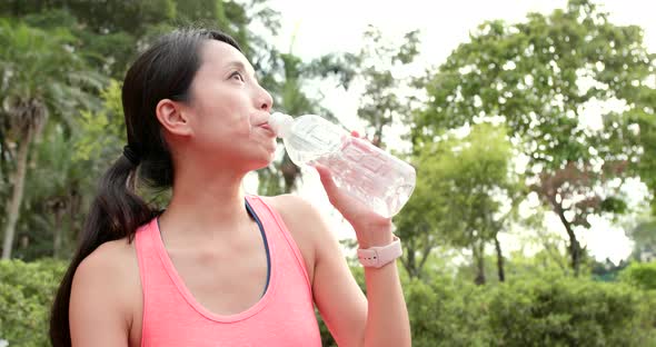 Sport woman drink of water bottle alt