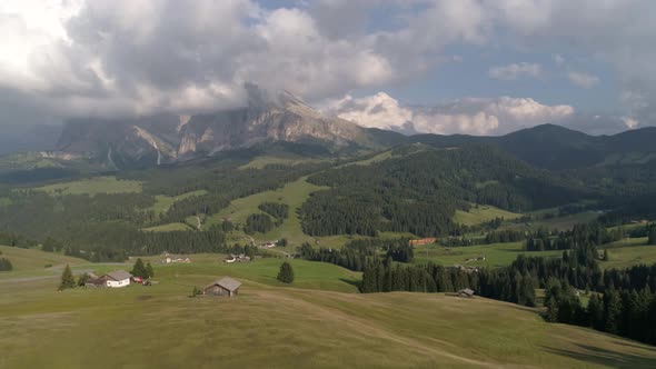 Aerial Drone video of the Sassolungo mountains on the Italian Alps Dolomites with birds flying on th alt
