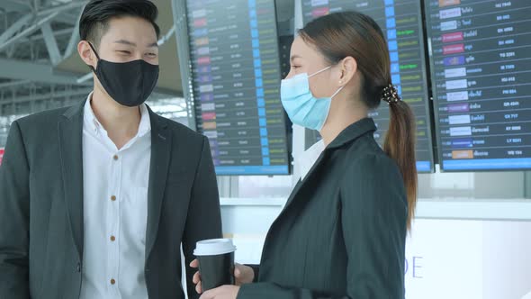 two asian businessman and businesswoman with face mask protection alt