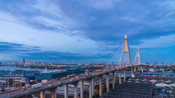 Large suspension bridge over Chao Phraya river, day to night - Time Lapse