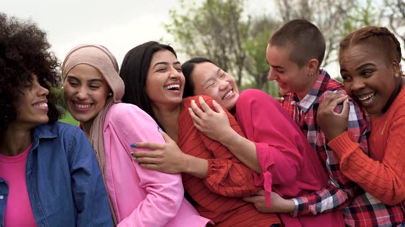 Happy multiracial women hugging each other - Beautiful diverse female friends