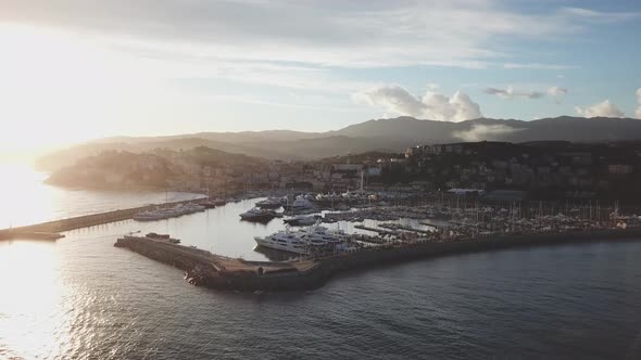 Imperia Borgo Prino sunset aerial view over the port harbor city in Liguria, Mediterranean sea. Port alt