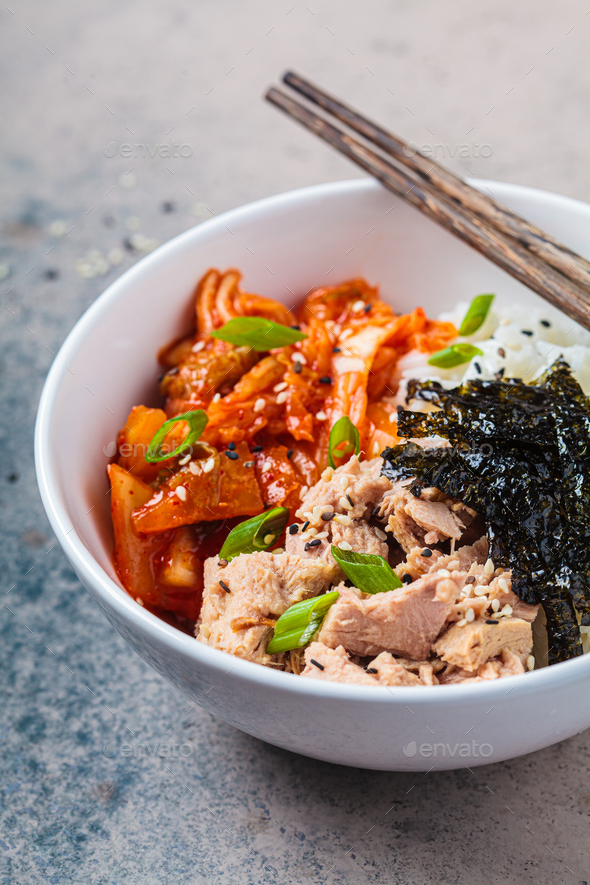Kimchi tuna rice salad in white bowl. Traditional Korean food. Stock