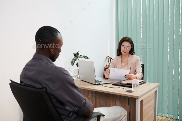 Human Resources Manager Reading CV - Stock Photo - Images
