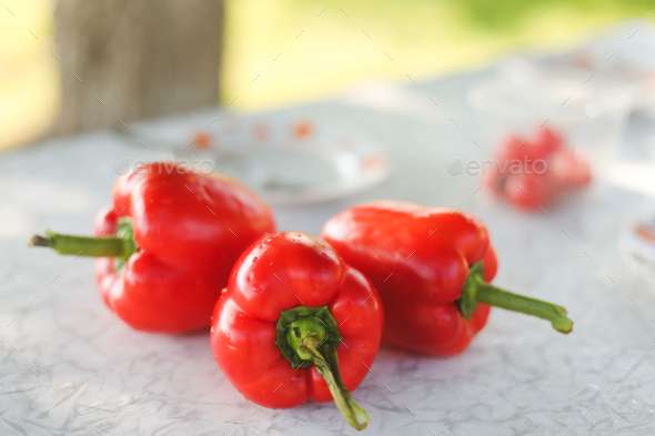 Sweet red fresh Bell pepper on a white table - Stock Photo - Images