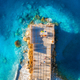 Aerial view of beautiful wooden pier, sea bay, sandy beach - PhotoDune Item for Sale