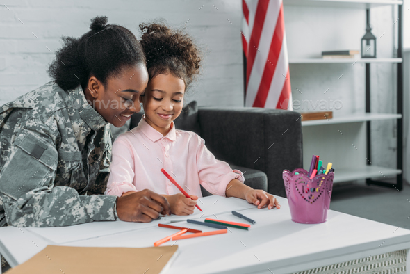 Mother army soldier and her daughter drawing together Stock Photo by ...