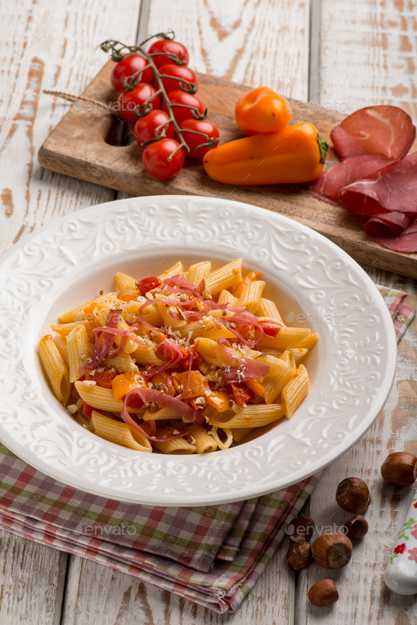 pasta with capsicum tomatoes and bresaola Stock Photo by MarcoMayer