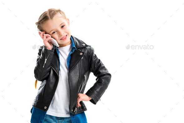 Portrait of stylish child talking on smartphone isolated on white - Stock Photo - Images