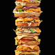 Piled Burger Tower on black background - PhotoDune Item for Sale