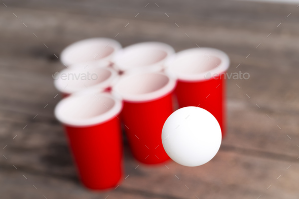 Game Beer Pong on wooden table - Stock Photo - Images